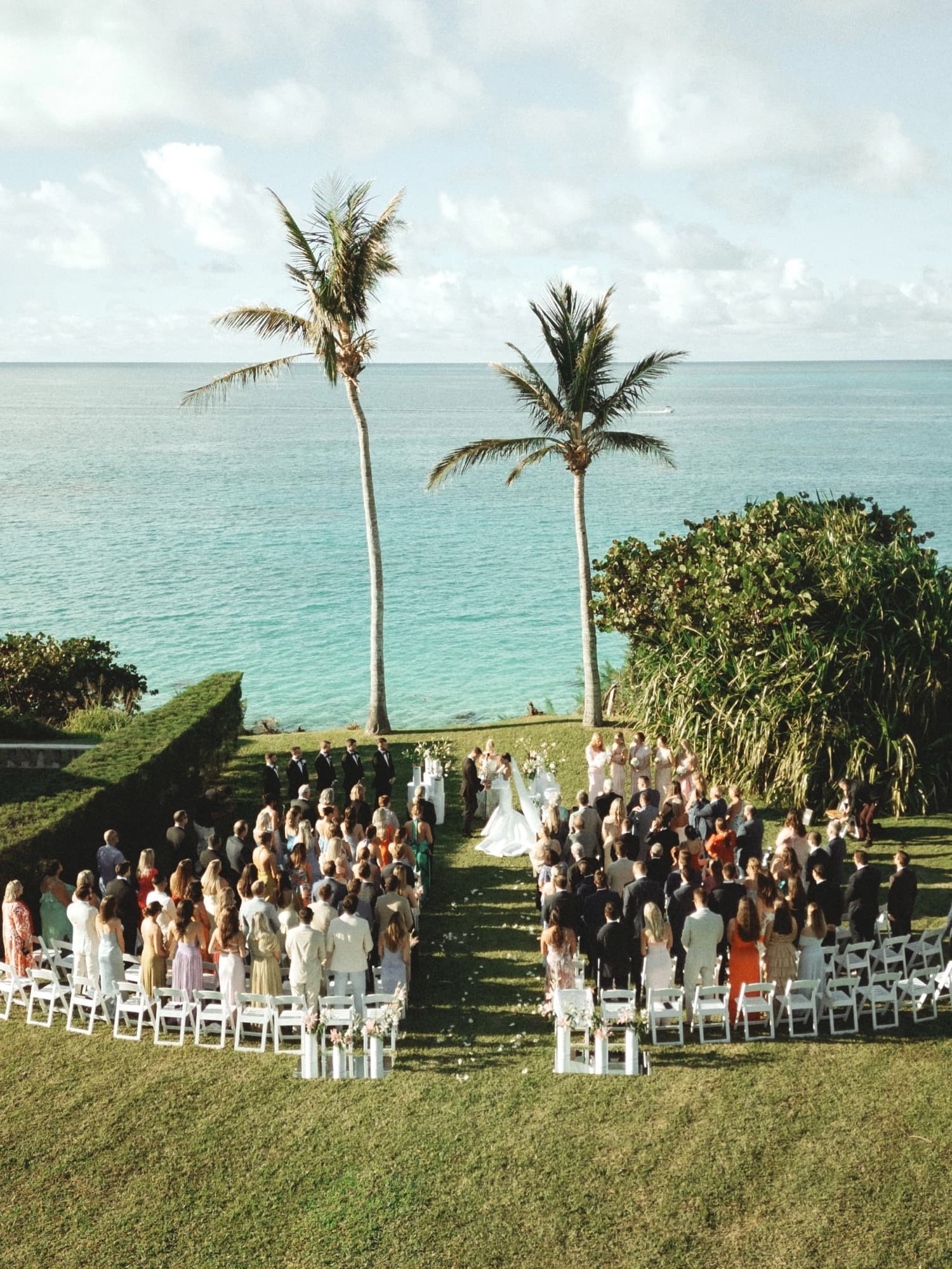 Outdoor wedding ceremony on a lawn above the ocean in Bermuda